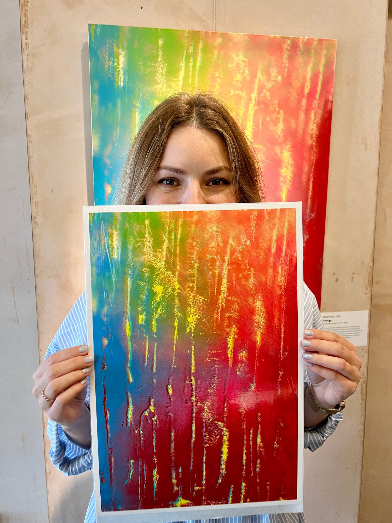 Djuro holding her first Vertigo print in front of the original painting