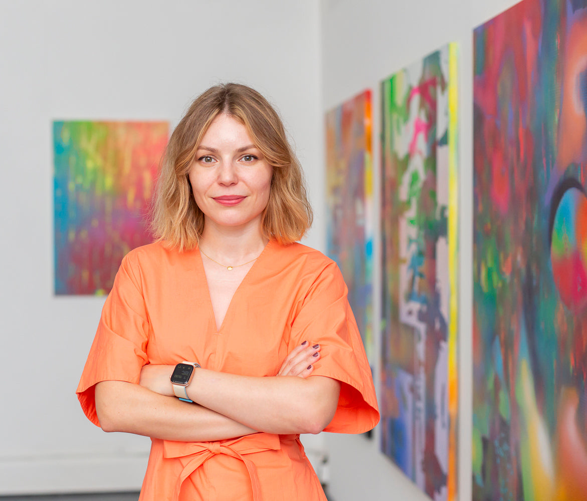 Durdica Selec, Djuro in front of her paintings